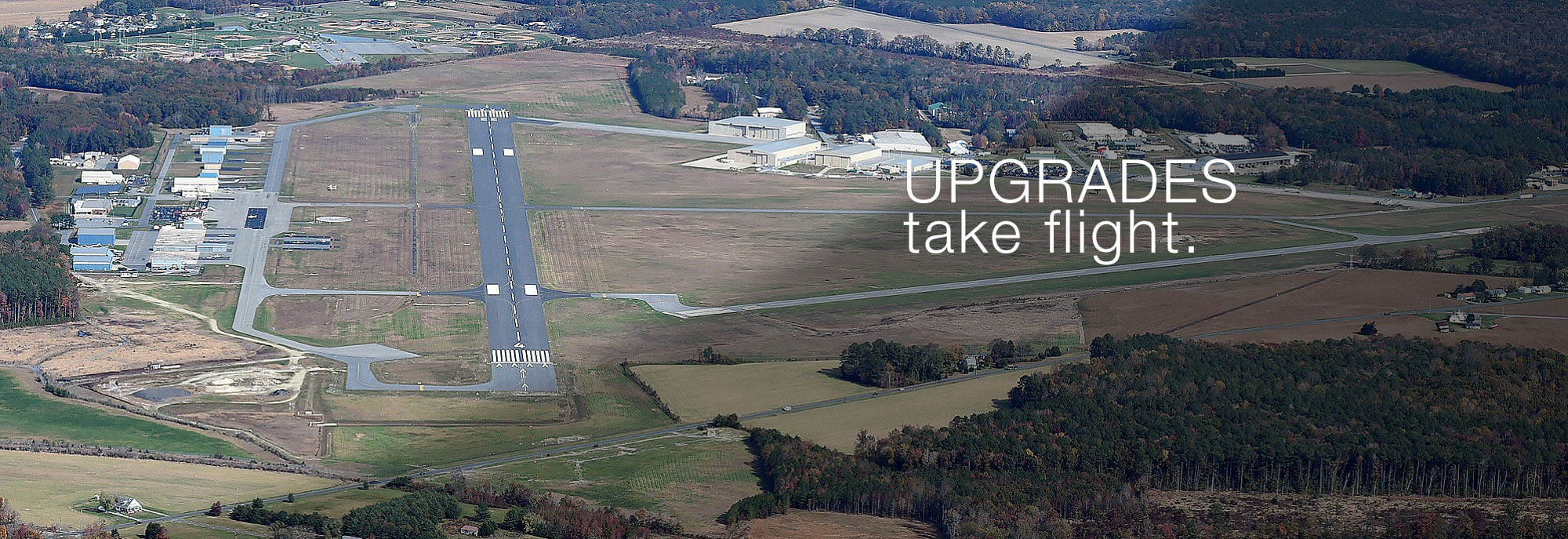 aerial view of sussex airport promoting upgrades take flight